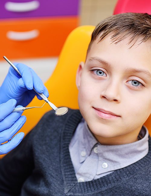 portrait-smiling-baby-boy-dental-chair