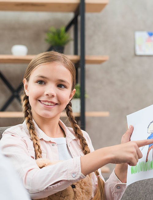 smiling-portrait-girl-showing-family-drawing-her-female-psychologist